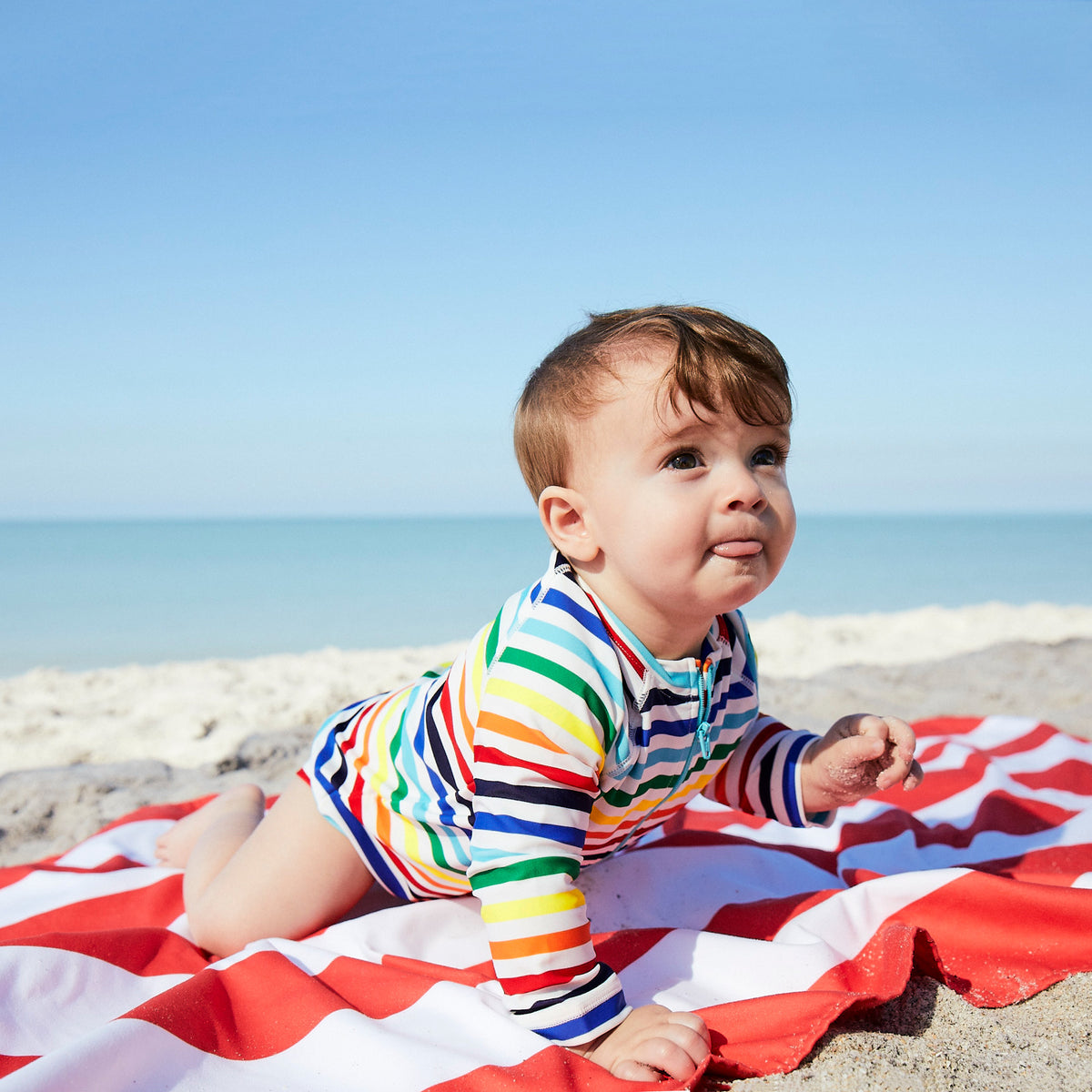 Baby one piece rash guard in rainbow stripe Primary