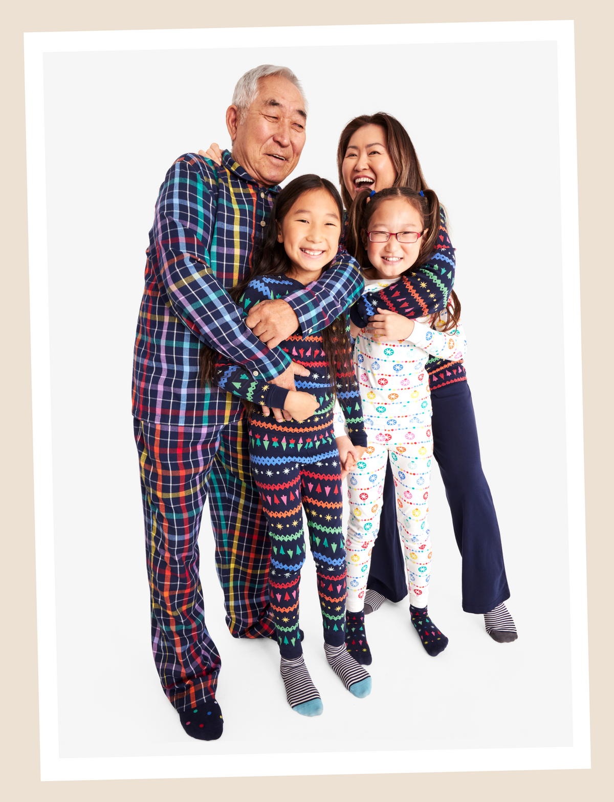 A family wearing PJs from our rainbow brights collection