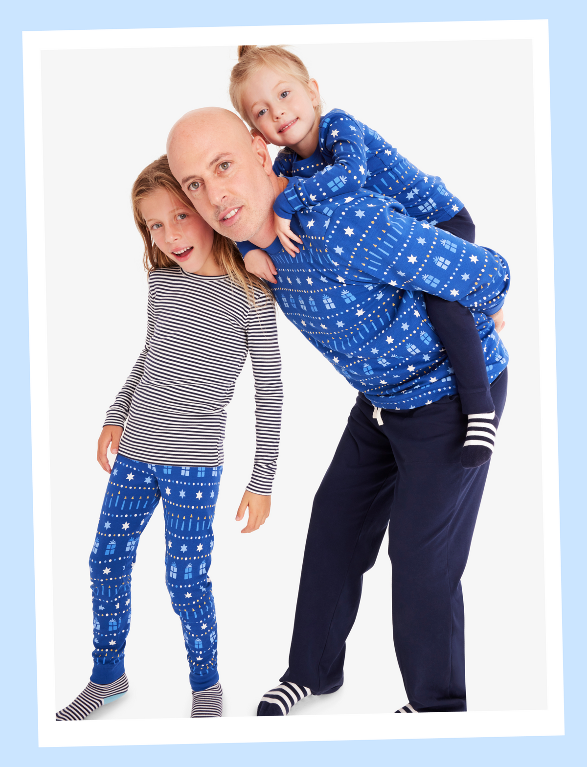 A family wearing PJs from our festive lights collection