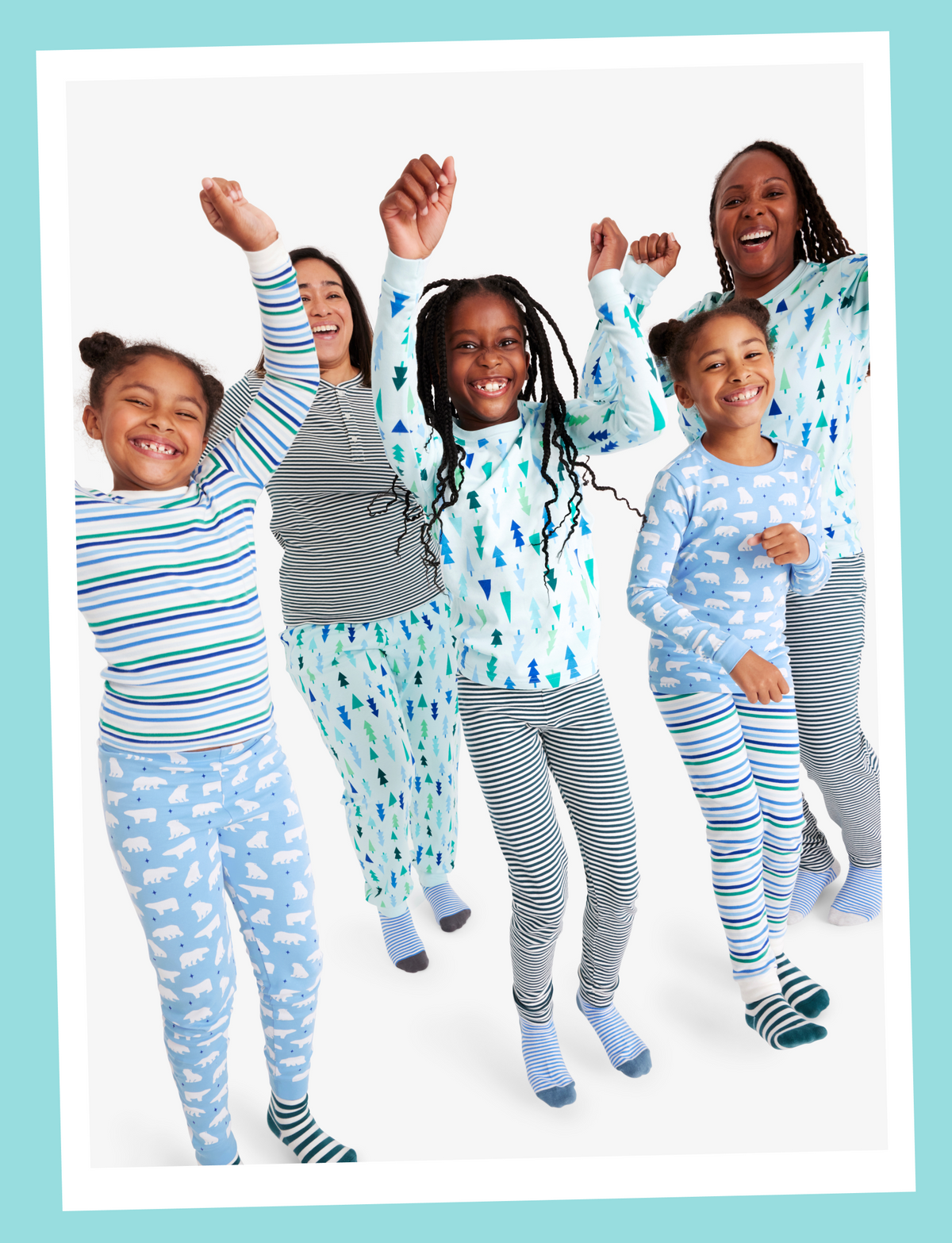 A family wearing PJs from our winter green collection