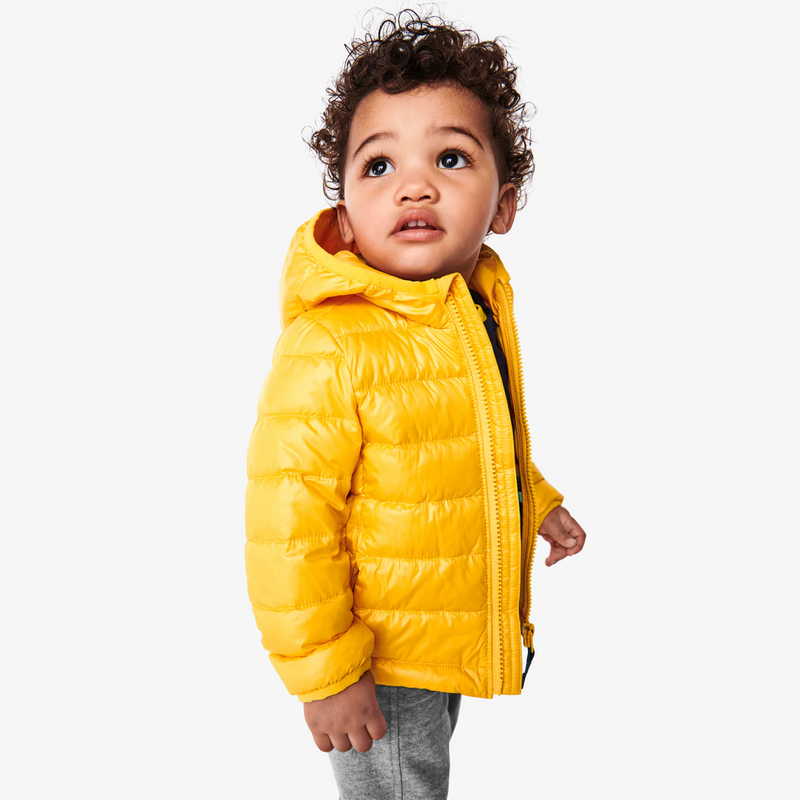 An image of a baby wearing a yellow color puffer jacket