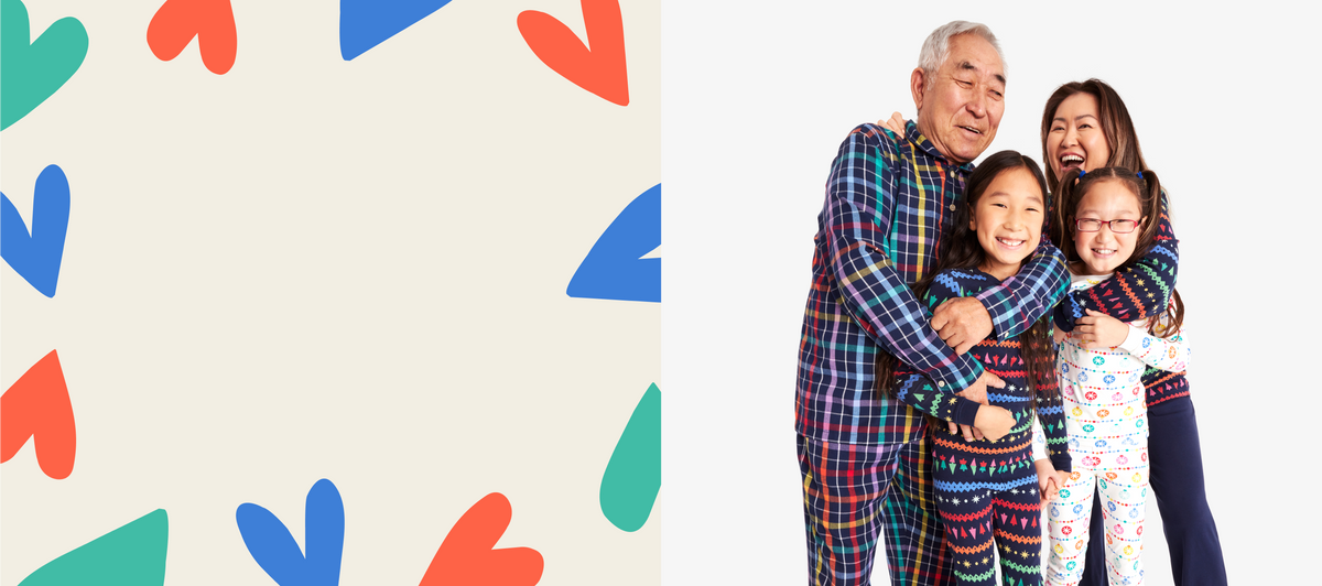 A family hugging wearing our mix and match rainbow PJs