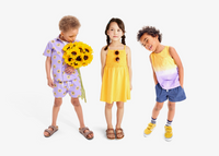 3 kids standing side by side wearing yellow and purple clothing part of our sunflower collection.
