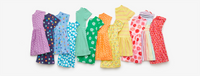 A laydown of 12 kids dresses showing the different prints and patterns in a rainbow order