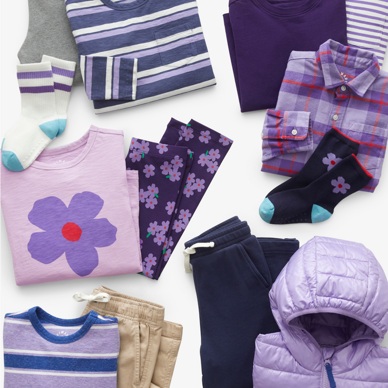 An image of neatly folded clothing part of our violet collection