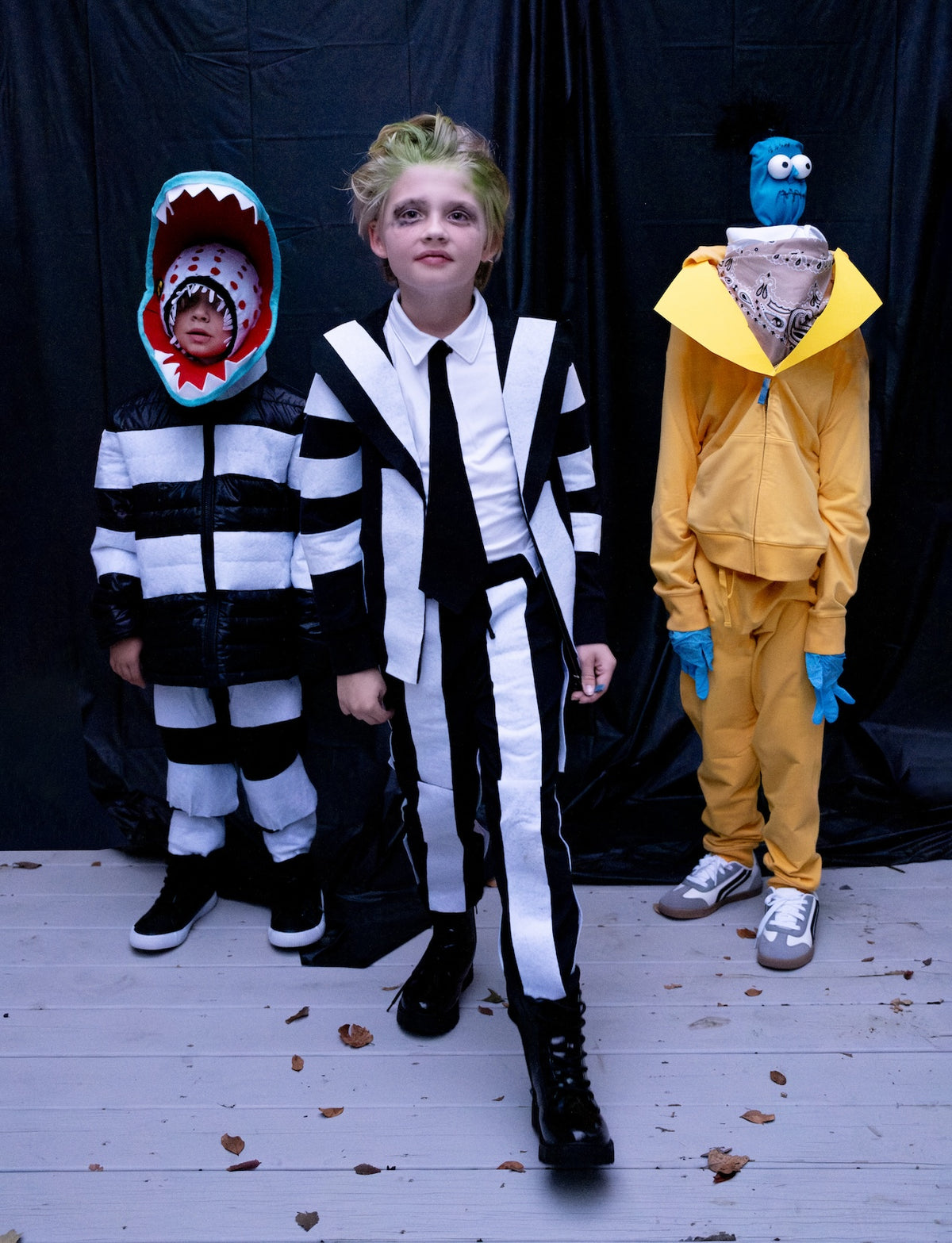 Kids dressed in Beetlejuice, Sandworm, and Bob costumes